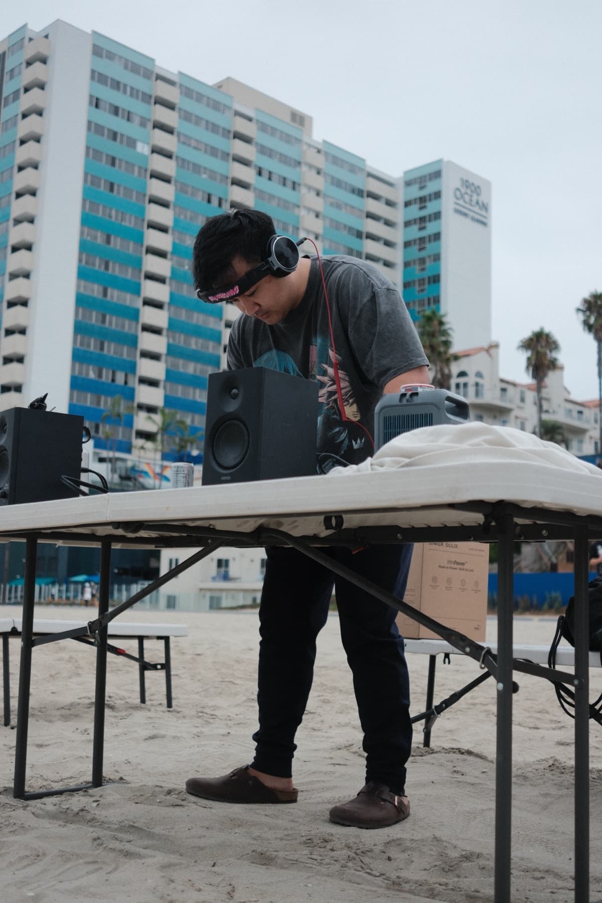 DJ table set up on the beach as part of the First Wave community activation.